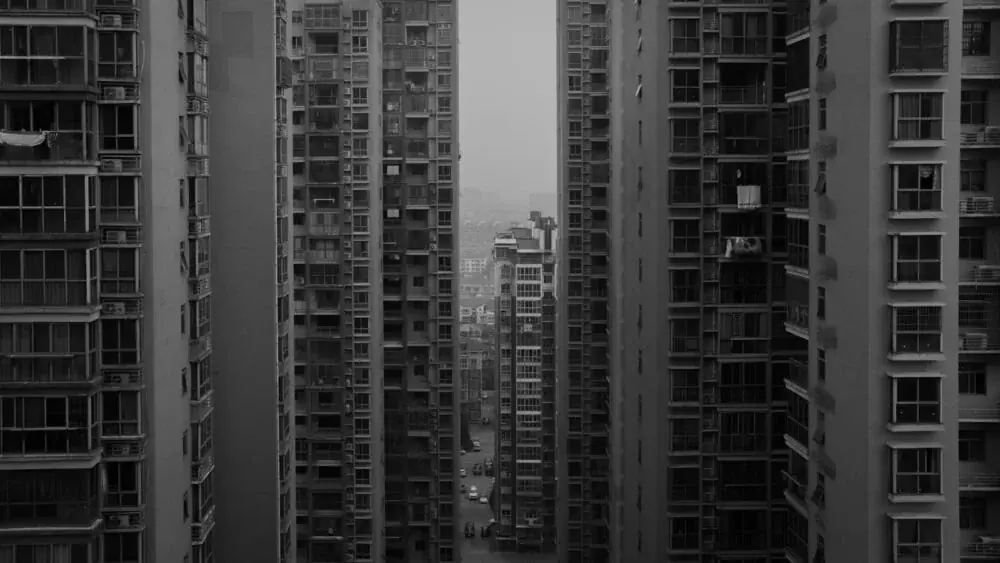 grayscale photo of high rise buildings
