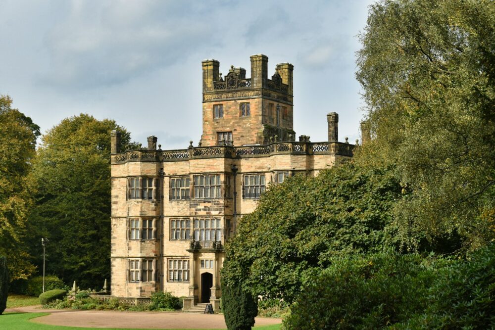 a large castle like building surrounded by trees