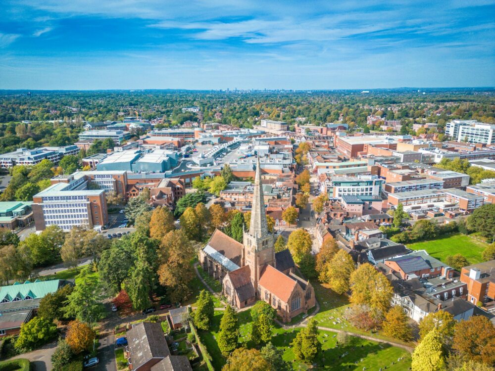 an aerial view of a city with trees and buildings