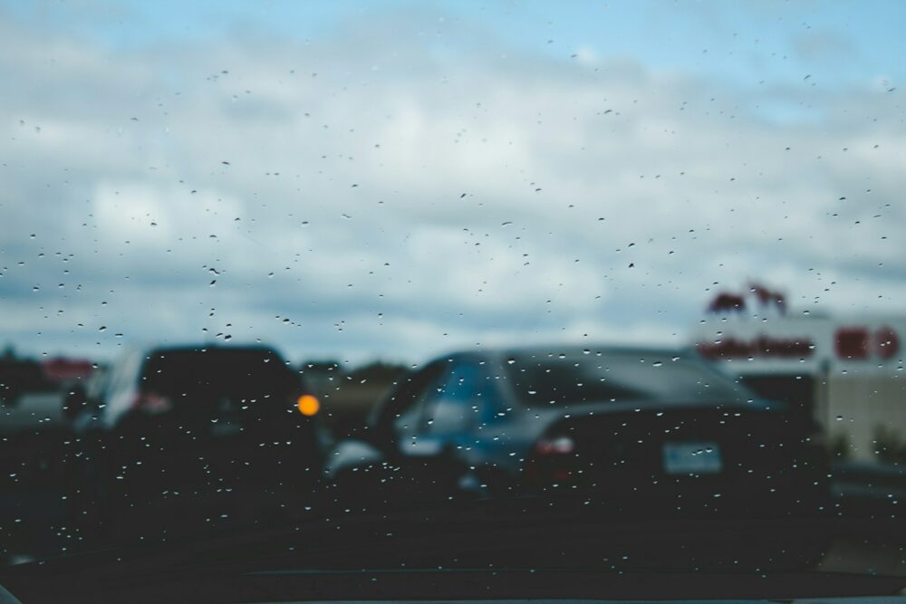 shallow focus photography of black car