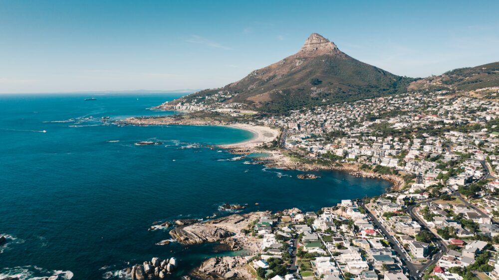 aerial view of city near body of water during daytime